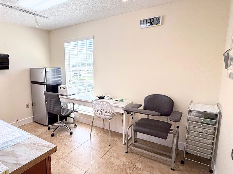 Sample processing area with counter and phlebotomy chair